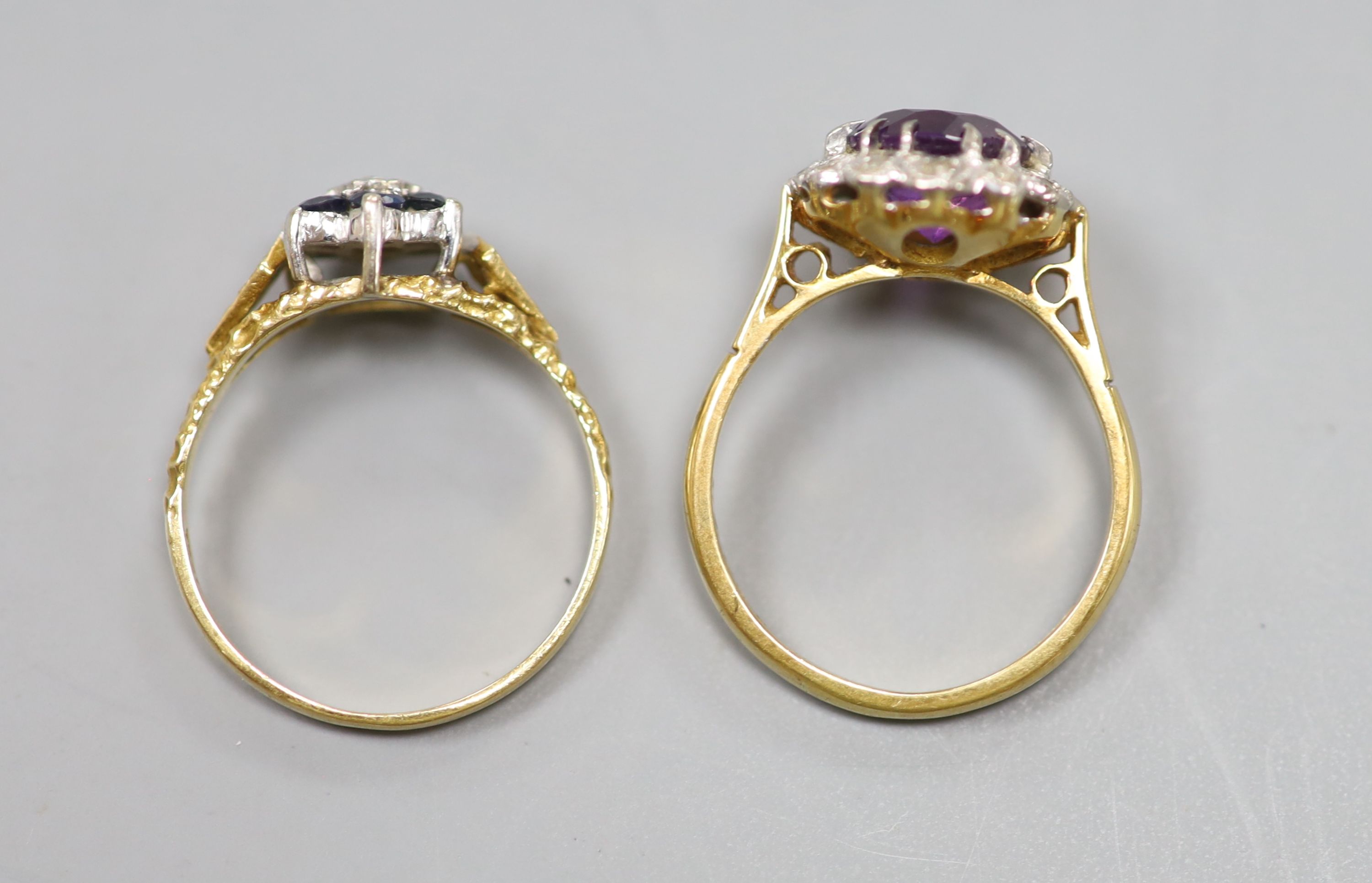 An 18ct yellow gold, diamond and amethyst cluster ring and an 18ct yellow gold, sapphire and diamond flower head ring, 7.1g